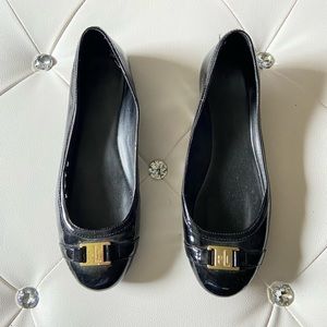 Ralph Lauren black patent flats with gold emblem